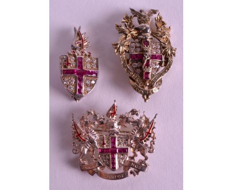 A FINE SILVER GILT AND ENAMEL SET OF THREE ROYAL BROOCHES by Kenning & Spencer, with pink stone surround and Latin inscriptio