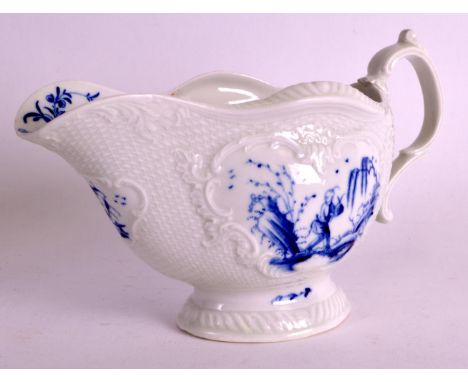 A RARE 18TH CENTURY WORCESTER BLUE AND WHITE SAUCEBOAT painted with the Man with a Bomb pattern. 8ins wide.