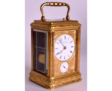 A FINE LATE 19TH CENTURY ENGRAVED BRASS CARRIAGE CLOCK by Howell Jones &amp; Co, decorated all over with organic scrolling fo