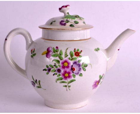 AN 18TH CENTURY WORCESTER TEAPOT AND COVER painted with floral sprays under a gilt rim. 7.5ins wide.