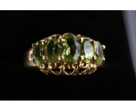9ct Gold ring set with 5 peridot stones Size Q 