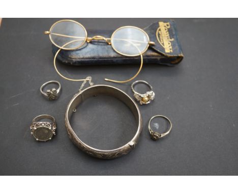 Silver bangle(bruised) together with 4 silver rings &amp; pair of gold plated spectacles 