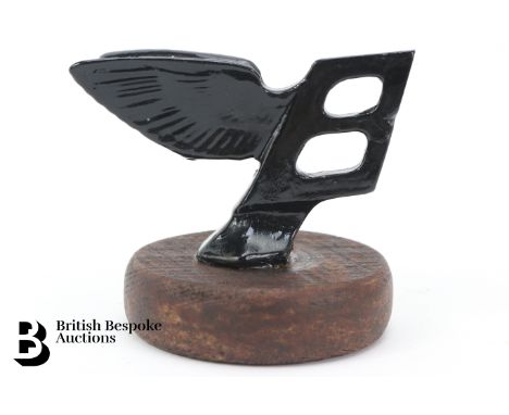 A black painted Bentley "Winged Flying B" radiator mascot, the design as fitted to a 1950's Bentley R-Type and MK6 motorcars,