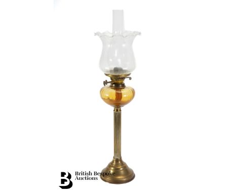 Edwardian oil lamp, brass column, with an amber glass oil reservoir, fluted glass shade, approx 70 cms h.
