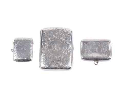 A circa 1900 silver cigarette case, a tobacco/snuff box and a vesta case. The largest engraved with scrolling leaves and a ce