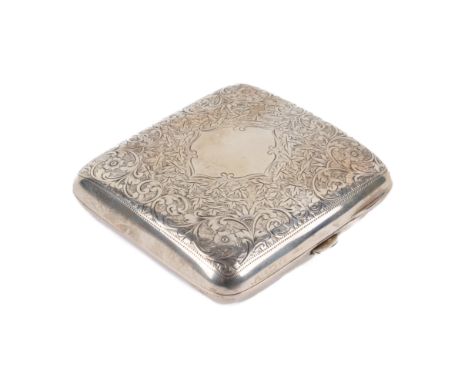 A silver cigarette case. Of slight convex form, engraved with leaves and scrolls around an empty, shaped reserve, gilt to the