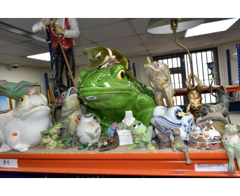 A LARGE QUANTITY OF FROG THEMED CERAMICS AND ORNAMENTS, comprising a pair of metal candle holders, brass lamp and ornaments, 