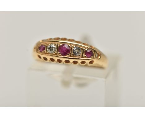 AN EARLY 20TH CENTURY RUBY AND DIAMOND, 18CT GOLD BOAT RING, set with three circular cut rubies, interspaced with two single 