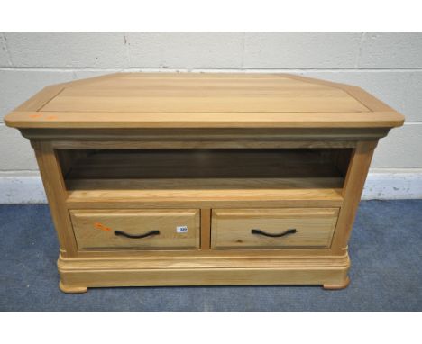 A LIGHT OAK CORNER TV STAND, with two drawers, width 102cm x depth 50cm x height 62cm (condition report: -good)