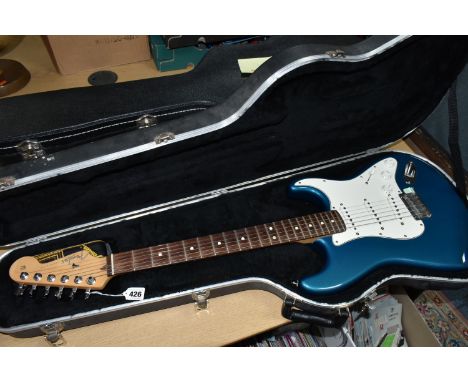 A 2000 USA FENDER STRATOCASTER GUITAR IN ORIGINAL HARDCASE finished in Aqua Flake paint, chrome hardware, tremolo and arm, th