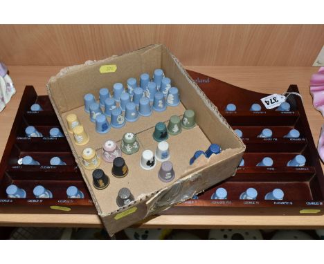 A WEDGWOOD BLUE JASPERWARE 'THE KING AND QUEENS OF ENGLAND' THIMBLE COLLECTION WITH DISPLAY SHELF, comprising forty-one Kings