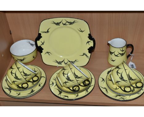 A TWENTY ONE PIECE ART DECO GRIMWADES ATLAS CHINA PART TEA SET IN 'SWALLOWS' PATTERN, decorated with black printed swallows o