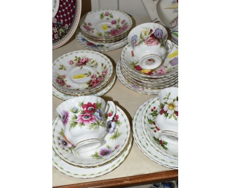 TWENTY FIVE PIECES OF ROYAL ALBERT 'FLOWERS OF THE MONTH' TEAWARE, comprising in Christmas Rose pattern: a teacup, two saucer