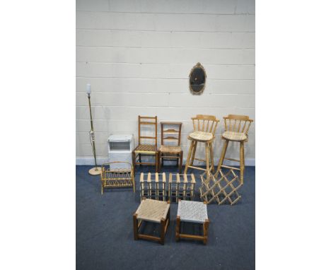 A SELECTION OF OCCASIONAL FURNITURE, to include a pair of beech high stools, three wine racks, wicker magazine rack, brass fr