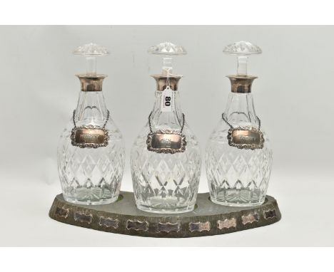 A SET OF THREE ELIZABETH II SILVER MOUNTED CUT GLASS MALLET SHAPED DECANTERS, with mushroom stoppers, silver mount makers J B