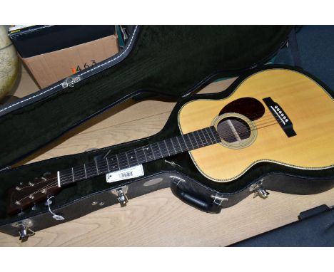 A 2016 MARTIN OM28 W/CS ACOUSTIC GUITAR with solid spruce top, natural finish, rosewood veneered back and sides, mahogany nec