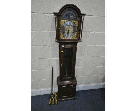 AN OAK LONGCASE CLOCK, the hood enclosing a brass/silvered 8 inch dial, and moonphase movement to the arch, and brass plaque 