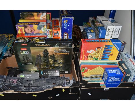 FOUR BOXES OF MODERN BOARD GAMES AND JIGSAWS, contents not checked, to include part constructed CubicFun Blackbeard's ship 'Q