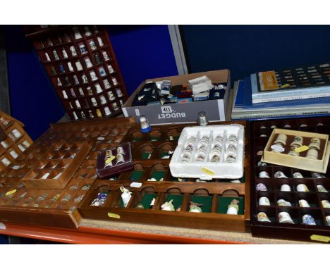 A LARGE COLLECTION OF THIMBLES, comprising six display shelves, over two hundred ceramic thimbles, to include a set of Willia