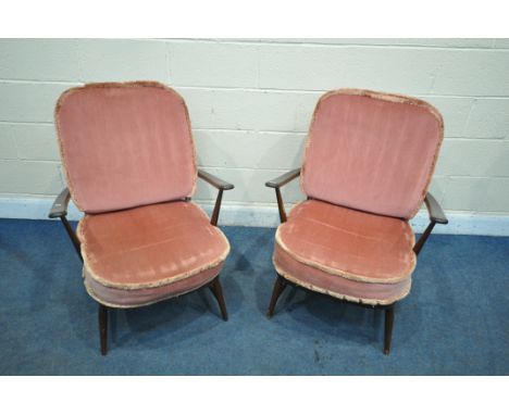 A PAIR OF ERCOL WINDSOR ARMCHAIRS, with loose pink cushions (condition report: -overpainted/stained, the cushions does not co