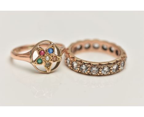 TWO GEM SET RINGS, the first designed as an open work star, set with various small gemstones such as emerald, ruby, sapphire,