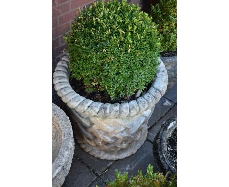 A LARGE COMPOSITE CYLINDRICAL TAPERED GARDEN PLANTER, with rope effect rims, and lattice style detail, height 54cm (condition