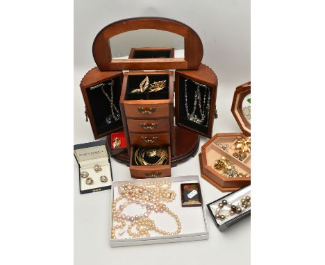 TWO WOODEN JEWELLERY BOXES WITH JEWELLERY, to include a four draw two cupboard jewellery box with hinged top, contains costum