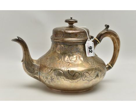 A VICTORIAN IRISH SILVER TEAPOT OF SQUAT PEAR SHAPE, domed cover with knop finial, foliate scroll engraved throughout, C scro