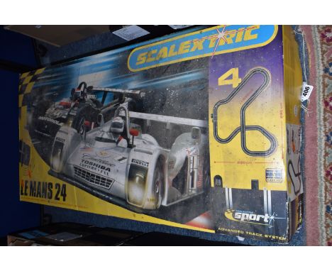 A BOXED SCALEXTRIC LE MANS 24 HOUR SET, No.C1083, contents not checked but with both cars, quantity of track, accessories and