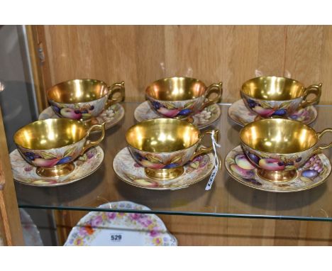 SIX AYNSLEY 'ORCHARD GOLD' TEACUPS AND SAUCERS, each cup with gilt interior, handle and foot, printed and tinted pattern with