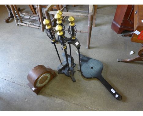 An oak mantel clock, steel and brass companion set and fire bellows
