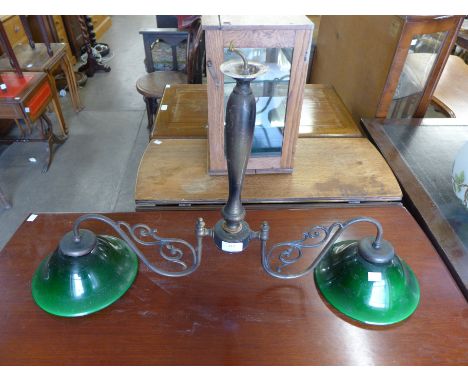 A brass and green glass two branch hanging light