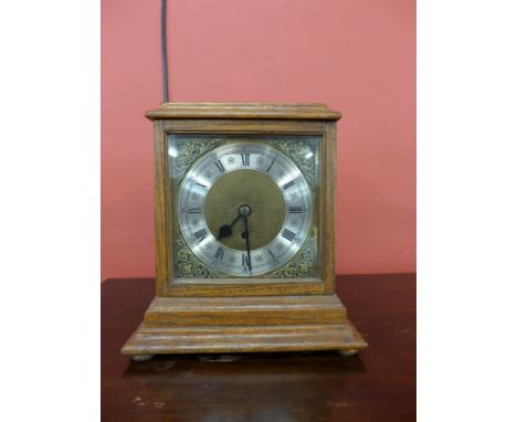 An oak mantel clock