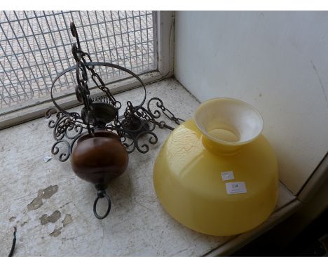 A wrought steel and glass hanging light