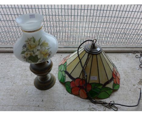 A Tiffany style hanging light and a Victorian brass oil lamp