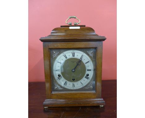A mahogany mantel clock, the dial signed Arthur Saunders, London