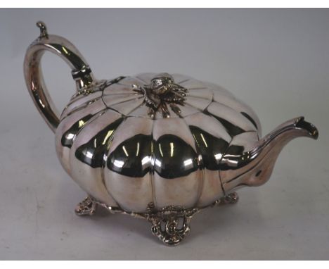 BRITANNIA METAL MELON SHAPED TEAPOT by Thomas Otley with scroll handle, bud finial and pierced scroll feet 