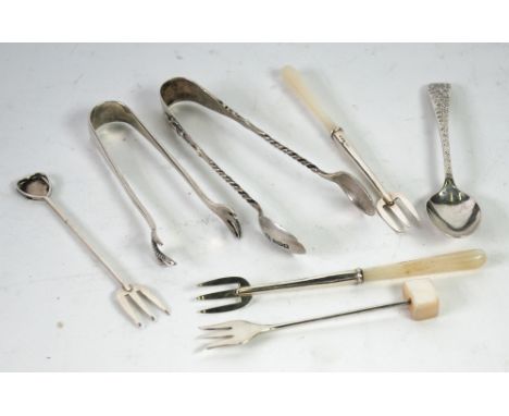 SIX SMALL PIECES OF SILVER SERVING CUTLERY, including; two pairs of  SUGAR TONGS AND A PAIR OF HORS D'OEUVRE'S FORKS with mot