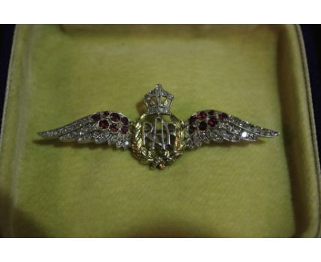 AN RAF WINGS BROOCH with ruby and diamond and chip setting