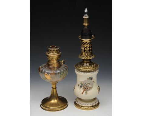A FRENCH PORCELAIN AND GILT METAL OIL LAMP with glass funnel 53cm and one other painted glass and brass oil lamp with opaque 