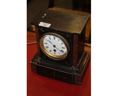 A VICTORIAN BLACK SLATE MANTEL CLOCK with striking movement