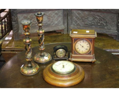 AN OAK CASED BAROMETER, a walnut cased mantel clock, a bedside clock and a pair of Kashmiri candlesticks