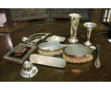 A COLLECTION OF SILVERWARES two silver backed brushes, a silver rose vase, a silver vase of tapering form, an inkwell, a bon 