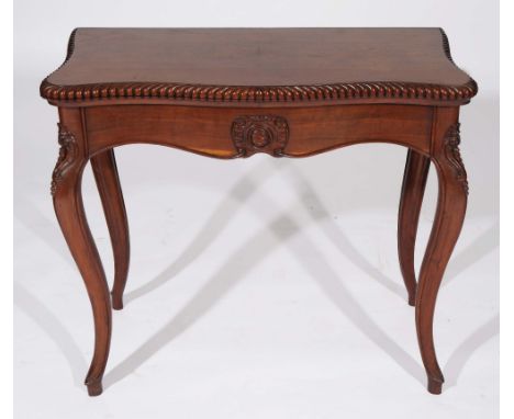 A 19TH CENTURY MAHOGANY SERPENTINE CARD TABLE having a gadrooned top, on cabriole carved supports, 85cm 