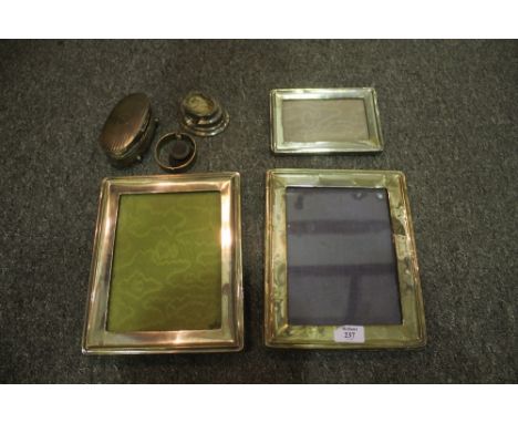 A SMALL COLLECTION OF SILVER to include frames, a silver bangle, trophy cups and other pieces