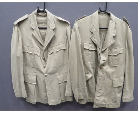 Two Khaki Drill Jackets light khaki drill, single breasted, open collar tunic. &nbsp;Pleated chest and lower bag pockets, all