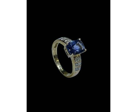 9 carat gold, tanzanite and diamond ring, size M.
