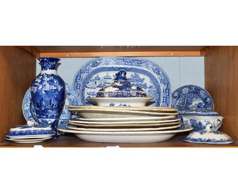 Early 19th century and later English blue and white pottery, to include: meat plates, tureens, and a vase (one shelf)