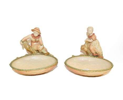A pair of Royal Worcester comports, each modelled as a boy and a girl on a tree, some dated 1886 with puce marks, 15.5cm .  G