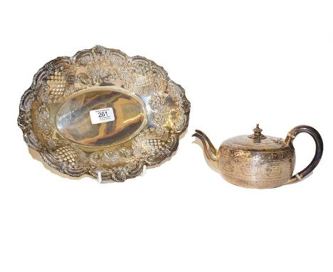 A Victorian silver bachelors teapot of bullet form by Samuel Smith, London, 1875 together with a Victorian pierced silver dis